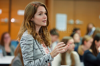 Businesswoman, conference or speaker sharing information at a business seminar for knowledge, motivational or coaching. Confident, woman or coach speaks to audience at a convention or corporate event