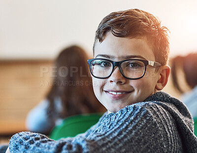 Buy stock photo Cropped shot of an elementary school boy in the classroom