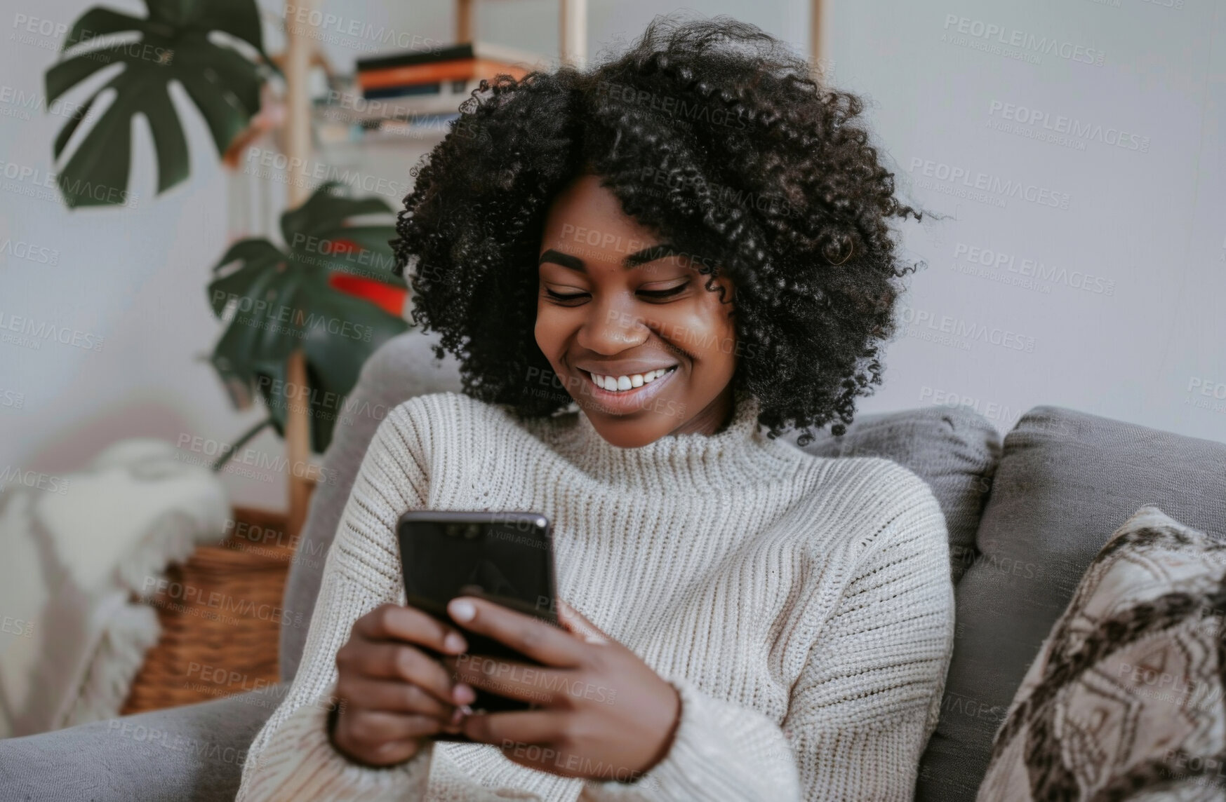 Buy stock photo Smartphone, couch and woman typing a message for social media marketing, business or networking. Cheerful, young and African female texting friends or colleagues for content creation and scrolling