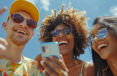 Smartphone, group and friends looking at a funny social media post, video call or internet clips. Cheerful, young and teens laughing and texting friends for content creation, application or scrolling