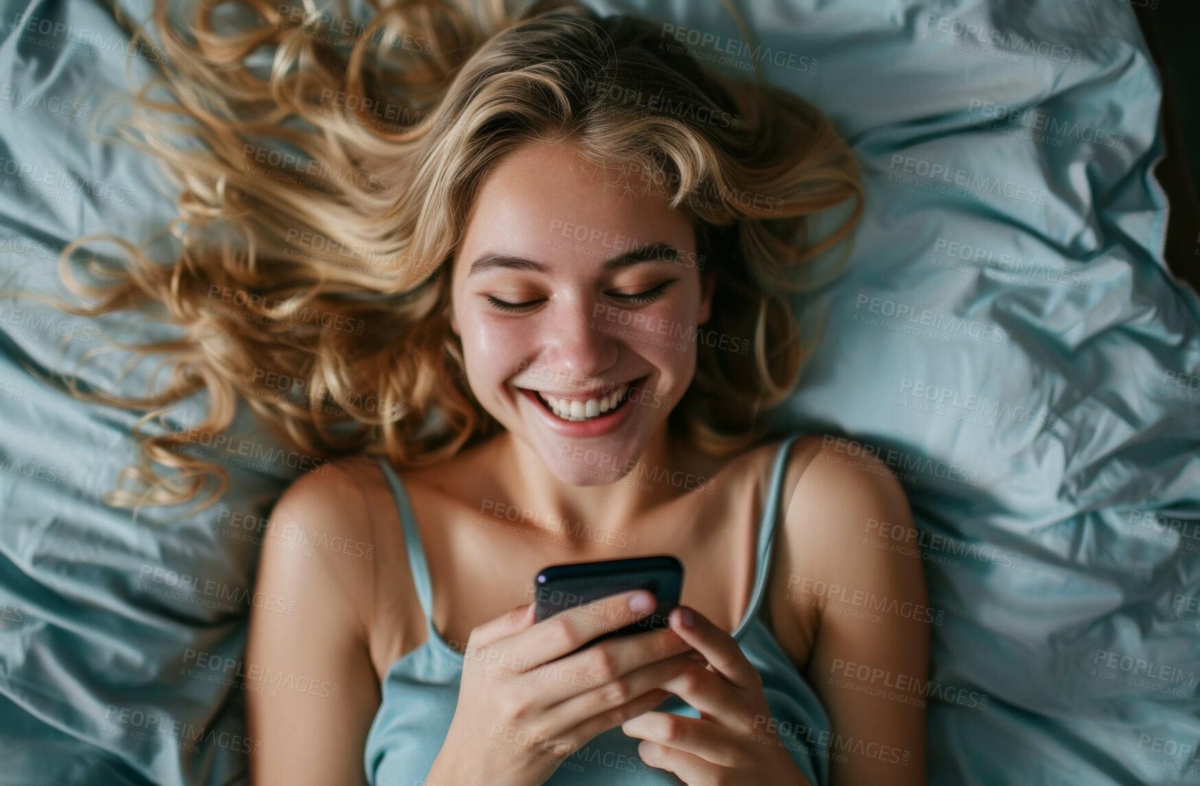 Buy stock photo Smartphone, bed and woman typing a message for social media , video call or networking. Cheerful, young and female laughing and texting friends or colleagues for content creation and scrolling