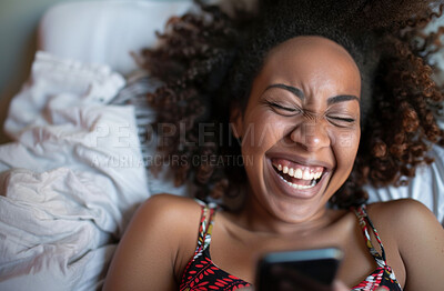 Smartphone, bed and woman typing a message for social media , video call or networking. Cheerful, young and female laughing and texting friends or colleagues for content creation and scrolling