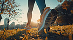 Female, running and athlete exercise in the morning for marathon competition, training or jogging workout alone. Low angle, sunrise and sport woman shoes mockup for challenge, technology or fitness