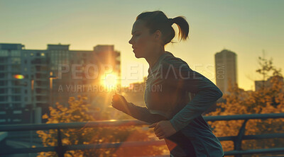Woman, running and athlete on a morning run in the city for training, fitness and workout. Confident, determined and focused female jogging at sunrise for marathon training, competition or exercise