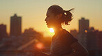 Woman, running and athlete on a morning run in the city for training, fitness and workout. Confident, determined and focused female jogging at sunrise for marathon training, competition or exercise