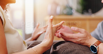Couple, hands and fight blame in home for unhealthy relationship or frustrated, conflict or problem. People, fingers and pointing on sofa in toxic conversation or unhappy dispute, cheating or drama