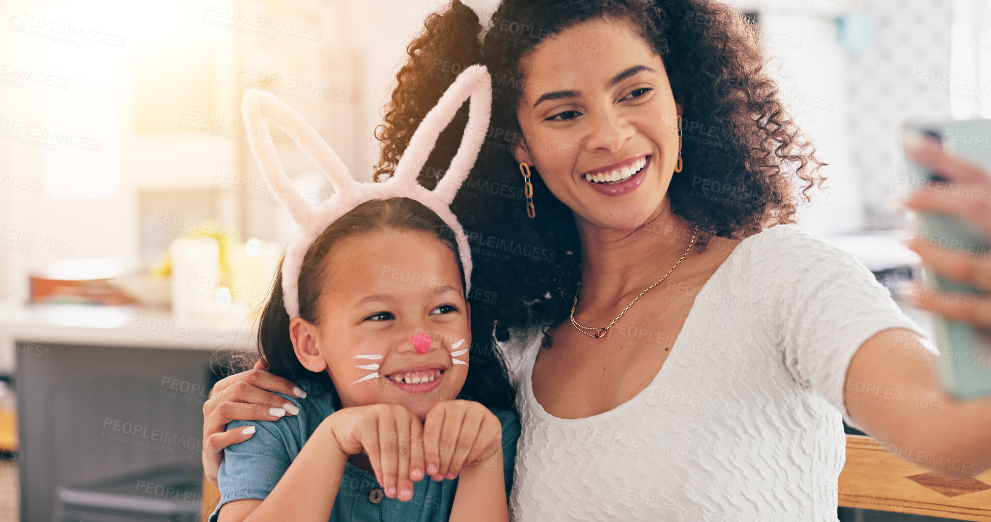 Buy stock photo Mother, child and easter in selfie, smile and bunny ears for festive holiday, face paint or post in family home. Mom, kid and rabbit costume with celebration, photography and memory on social network