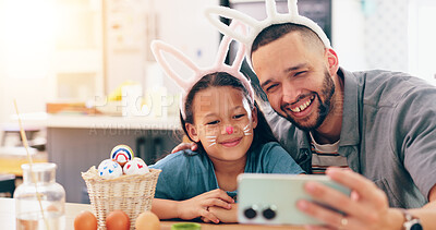 Father, child and easter in selfie, smile and bunny ears for festive holiday, face paint or post in family home. Dad, kid and rabbit costume with celebration, photography and memory on social network