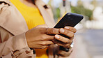 Hands, phone and woman in a city street for travel, search or di