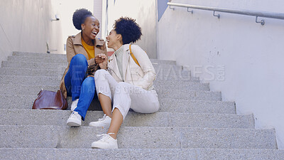 Buy stock photo Happy, laugh and women friends on stairs in a city for fun, bonding and hanging out on the weekend. Funny, conversation and people on steps with comedy, gossip or sharing silly, humor or joke outdoor