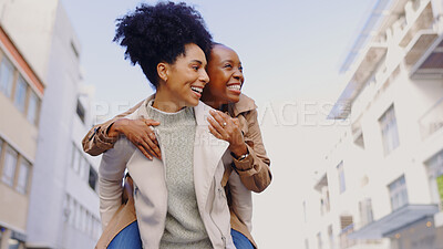 Buy stock photo Friends, women and happy with piggyback outdoor in city for travel, adventure or bonding in town together. Laugh, smile and people excited with back ride, playful or having fun on vacation or holiday