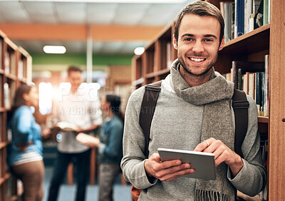 Buy stock photo Portrait of a university student using a digital tablet in the library at campus