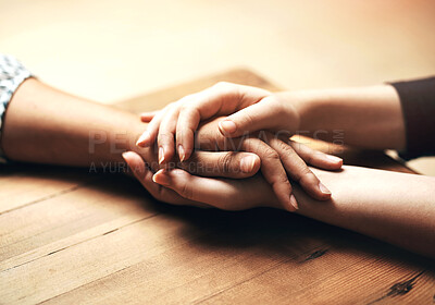 Buy stock photo Holding hands, cancer and support of friends, care and empathy together on table in home mockup. Kindness, love and women hold hand for hope, trust or prayer, comfort or compassion, help or unity.