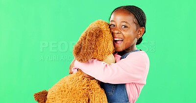 Green screen, love and a black girl hugging her teddy bear in studio in excitement or comfort. Portrait, happy and embrace with an adorable little female child holding her stuffed animal on chromakey