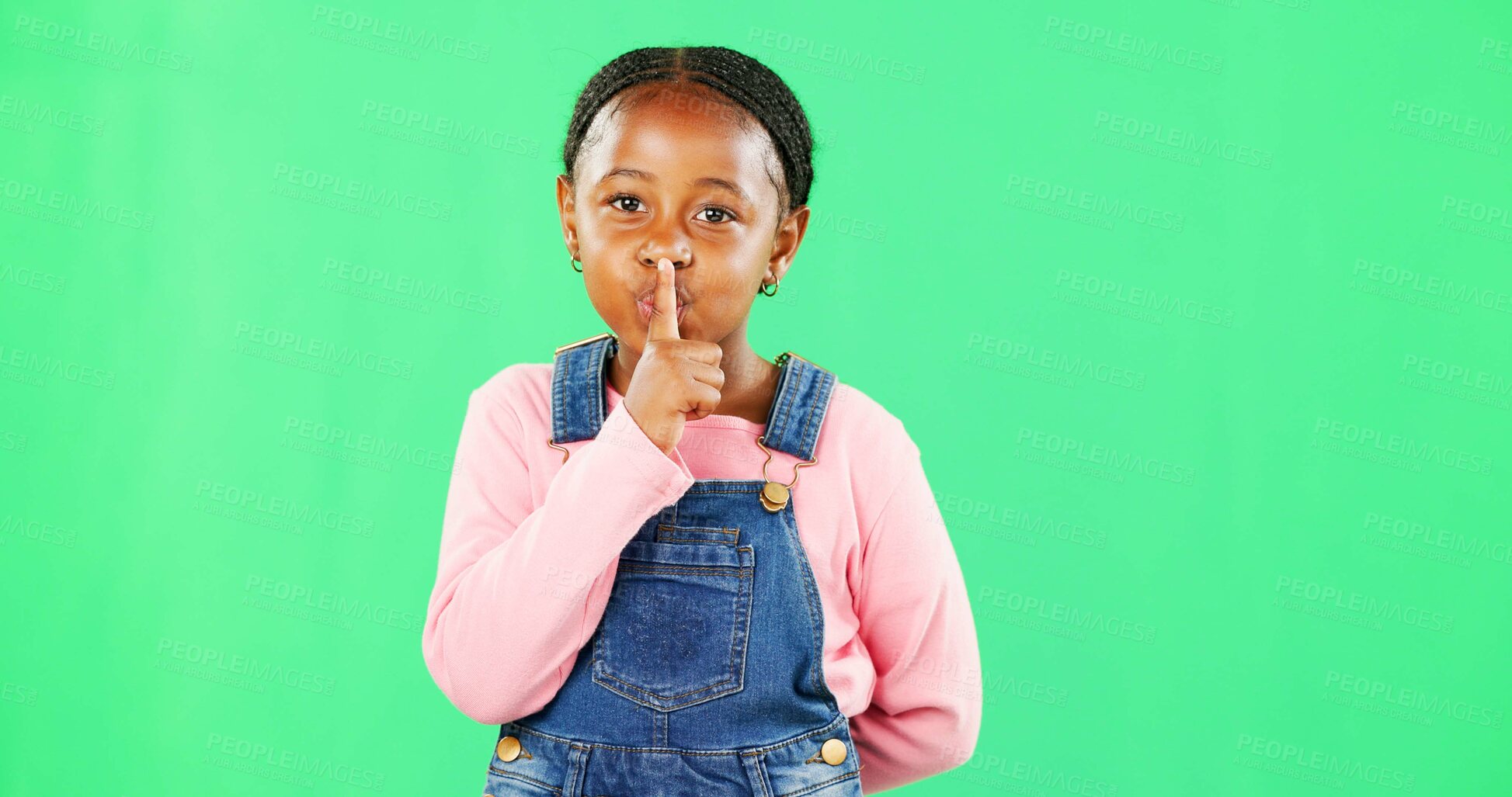 Buy stock photo Face, secret and black girl with finger on lips, silence and happiness against studio background. Portrait, African American female child and young person with gesture for quiet, kid and green screen