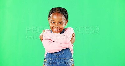 Girl, child and smile with hug for self love in portrait with fashion, pride and empowerment by green screen. African kid, happy and embrace with kindness, excited or growth with mockup for promotion