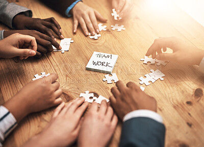 Buy stock photo Teamwork, puzzle and hands of business people in collaboration in a meeting together planning strategy at work. Circle, professional and group in a table with synergy as a workforce for innovation