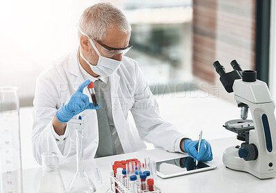 Buy stock photo Shot of a researcher at work on a microscope in a lab