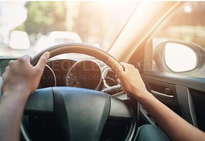 Buy stock photo Cropped shot of a man’s hands at the 10 and 2 position on a steering wheel of a car