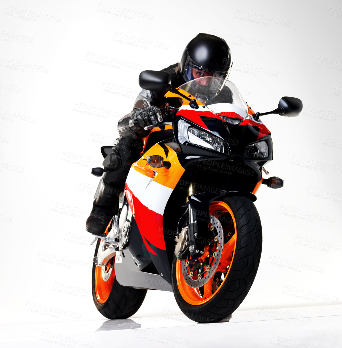 Buy stock photo Full length studio shot of a biker racing a superbike