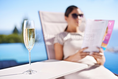 Buy stock photo Relax, pool and woman with champagne, magazine and reading in lounge chair on business trip. Travel, hospitality and businesswoman on deck with wine, book and sunshine holiday at luxury villa hotel