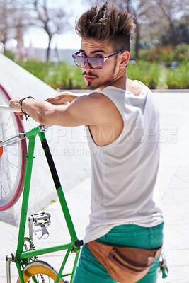 Buy stock photo Man, cool style and portrait with bike in city, outdoor and sunglasses for unique street fashion. Young gen z guy, funky male hipster and cycling on bicycle in summer, urban town and with attitude
