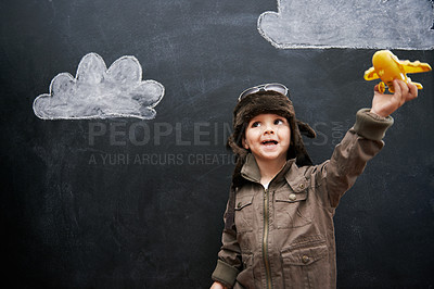 Buy stock photo Children, chalkboard and toy plane with boy in studio on black background for fantasy game. Imagination, classroom and kid pilot in costume at playing school for growth, learning or child development