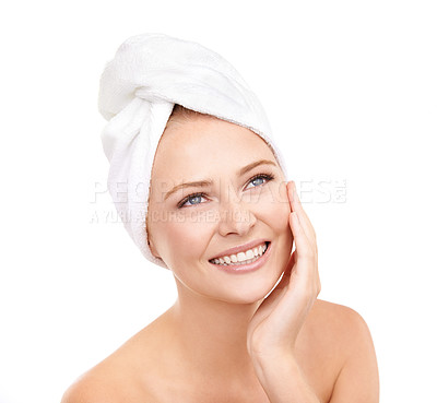 Buy stock photo Smile, spa and woman touch face, beauty or cosmetics in studio isolated on a white background. Skincare, hand and happy person with towel in treatment for dermatology, glow and thinking of makeup