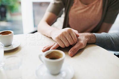 Buy stock photo Couple, holding hands and love in coffee shop on vacation and bonding together by espresso date. Man, woman and care in restaurant with morning cappuccino, touch and romantic or support in marriage