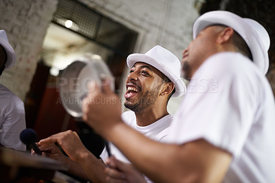 Buy stock photo Excited man, band and percussion with music at night for performance, singing or musical event. Happy person or group of musicians playing instruments for sound or fun local entertainment at concert