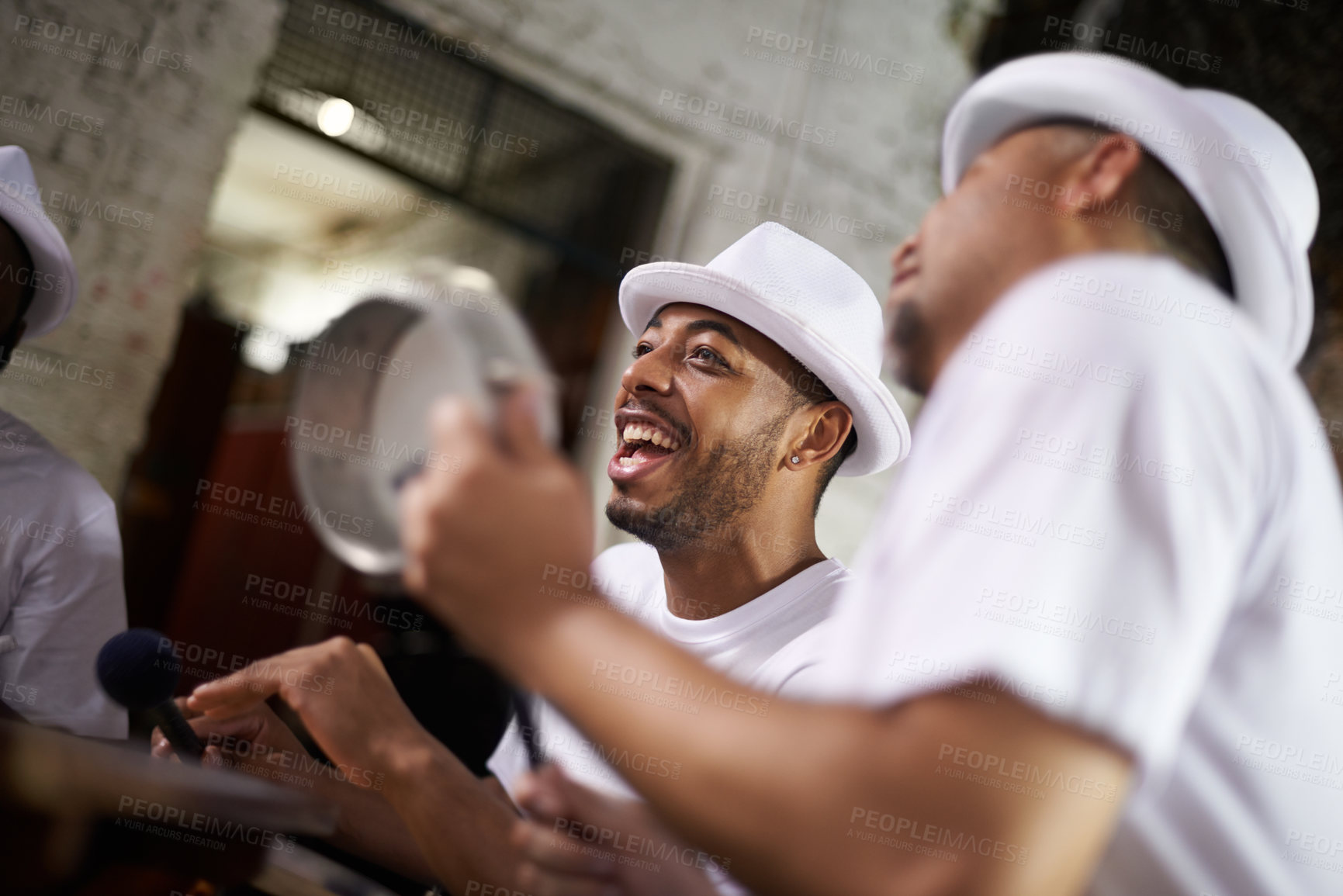 Buy stock photo Excited man, band and percussion with music at night for performance, singing or musical event. Happy person or group of musicians playing instruments for sound or fun local entertainment at concert