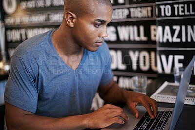 Buy stock photo Freelance, serious and man with laptop for work in cafe, typing and internet with social media. Information technology and web search for job, African male person with online connection for business 