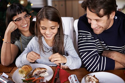 Buy stock photo Christmas, family and parents with child for dinner, lunch and eating together for festival event. Mother, father and girl with food for holiday, vacation and festive celebration at dining table