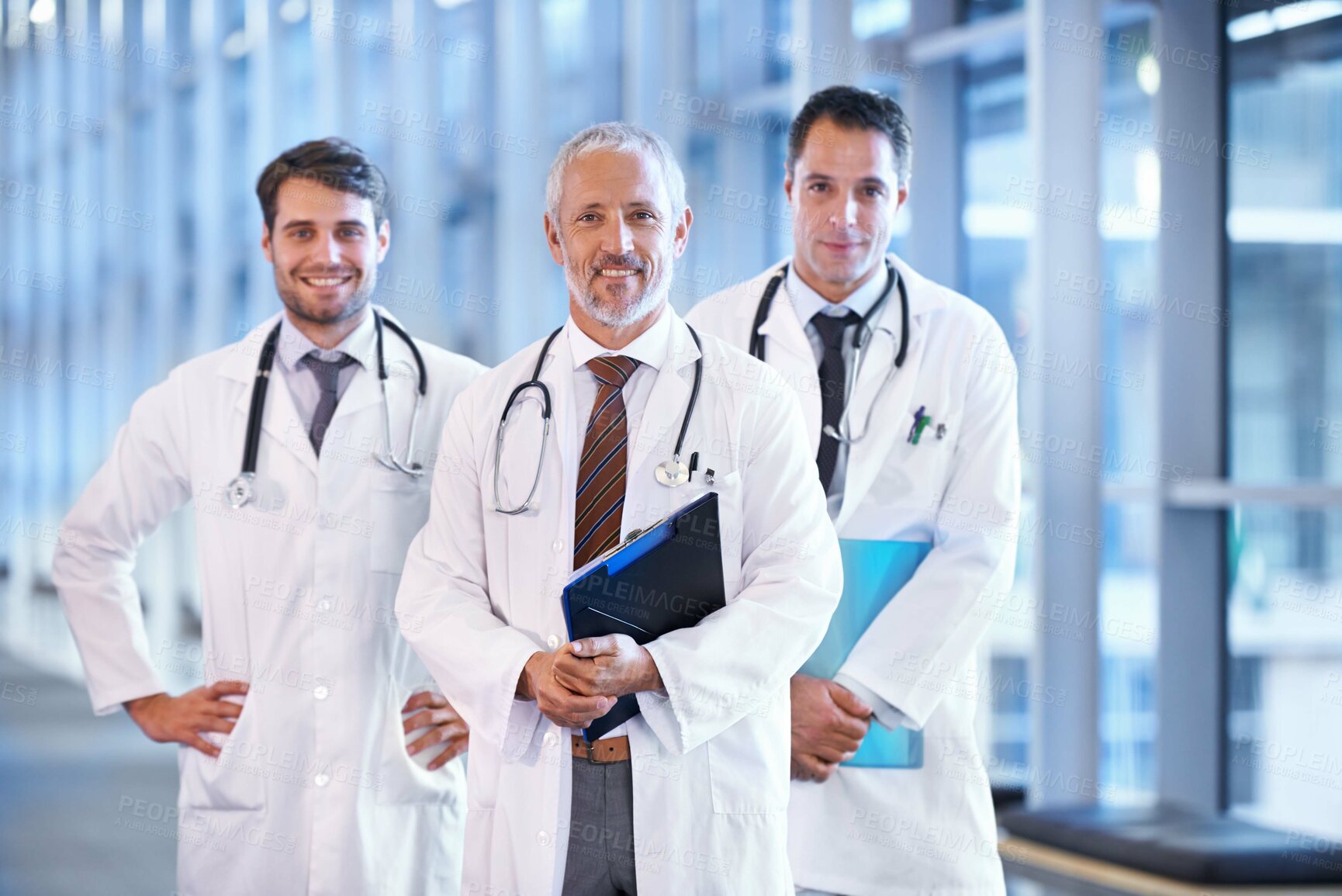 Buy stock photo A medical team standing in the hospital corridor