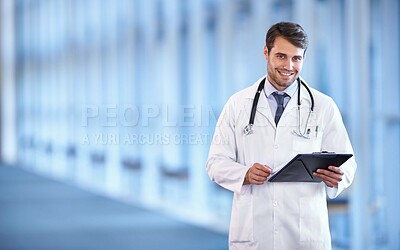 Buy stock photo Portrait of a happy young doctor standing in a hospital hallway with a patient's chart