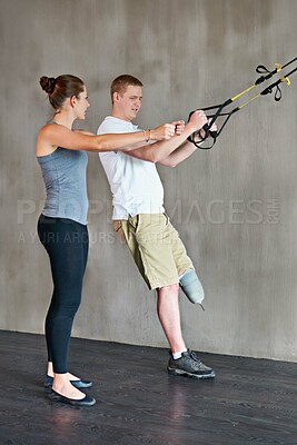 Buy stock photo Physical therapy, woman and patient with disability in studio for rehab, wellness and training support. Female person, man and physiotherapy with handicap for workout, health treatment and exercise