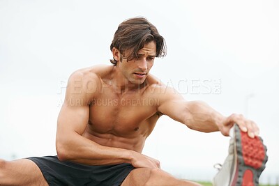 Buy stock photo Fitness, warm up and man on grass for workout, summer sports and wellness in outdoor training. Exercise, stretching legs and shirtless athlete on lawn for health, muscle and body care commitment.