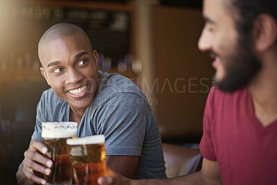 Buy stock photo Shot of two friends enjoying themselves in the pub