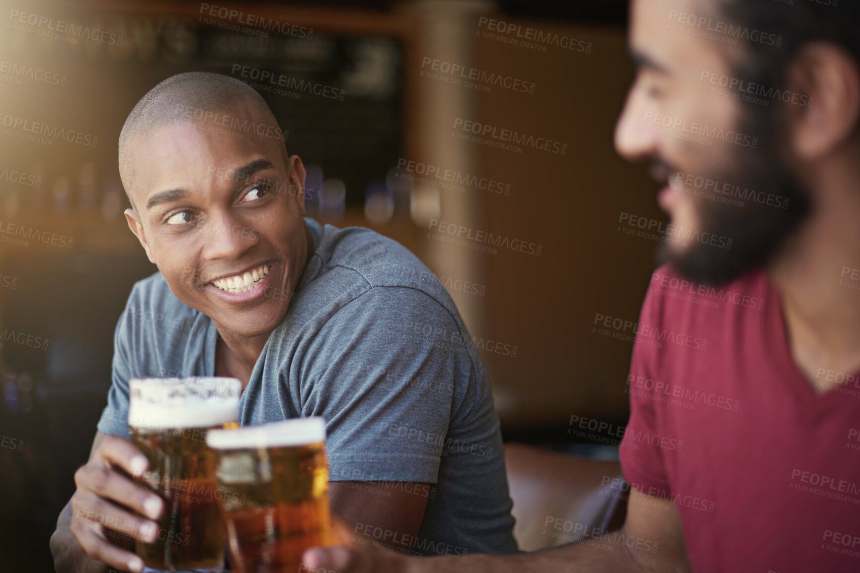 Buy stock photo Shot of two friends enjoying themselves in the pub