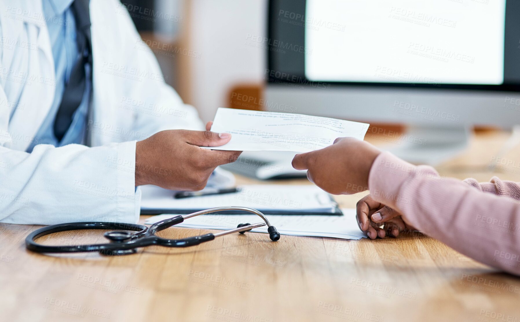 Buy stock photo Closeup shot of an unrecognisable doctor giving paperwork to a patient during a consultation