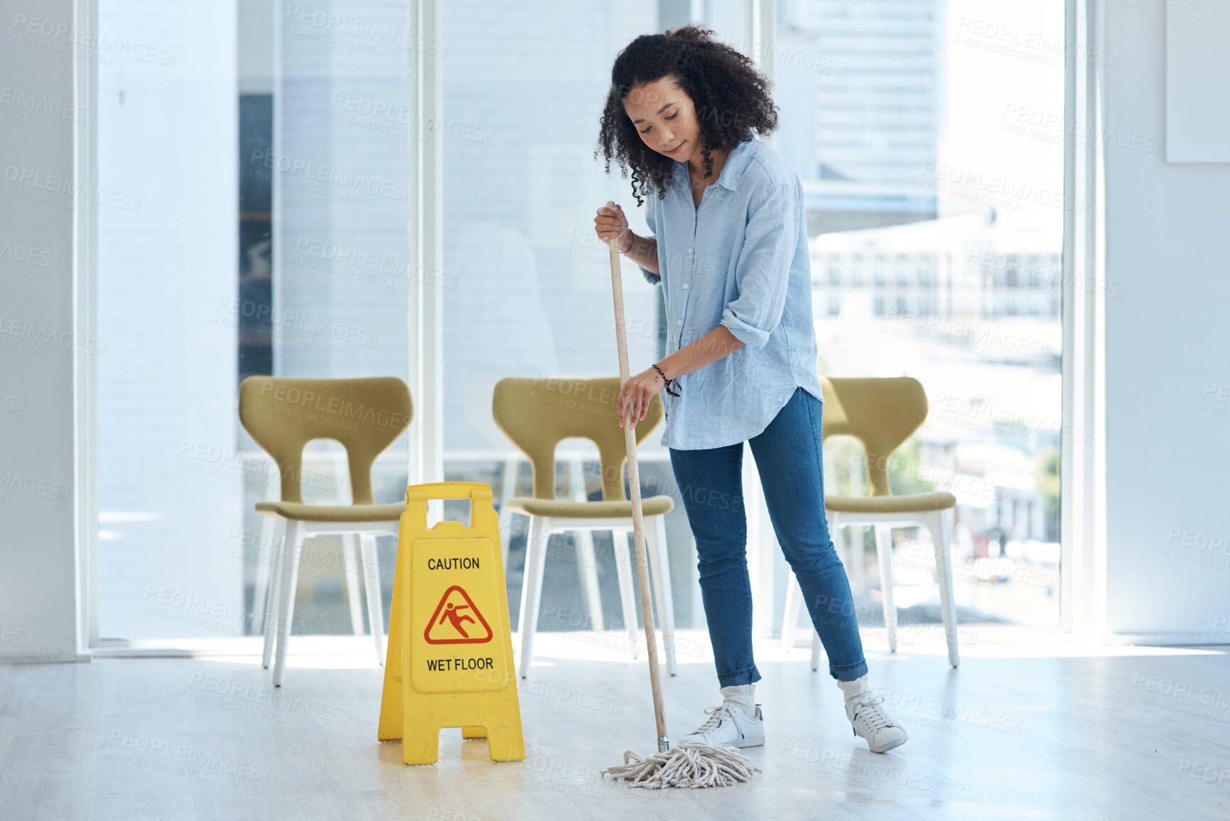 Buy stock photo Shot of a young woman mopping her floor at home