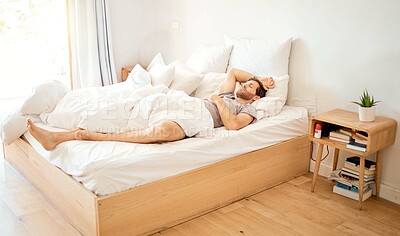 Buy stock photo Relaxed man sleeping in bed at home, tired person having dream in bedroom and resting on vacation in house. Exhausted male relaxing at hotel, looking cozy in the morning and sleepy on soft sheets