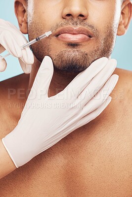 Buy stock photo Skincare, botox and lips with a man in studio on a gray background for a plastic surgery injection. Hands, beauty and syringe with a young male patient indoor for an antiaging facial filler closeup