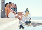Friends relax after roller blade skate travel, trip or journey around city or town. Young people, women and man or students sitting on floor calm, happy and smile after fun hobby adventure activity