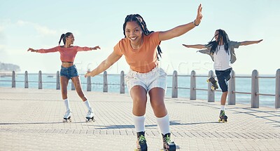 Buy stock photo Friends, fitness and roller skating at the beach in summer as a group of young gen z girls and boy skate in freedom. Smile, happy and active people riding blades on the promenade on holiday vacation