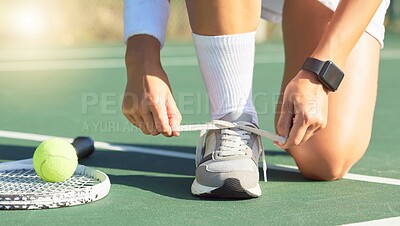 Tennis, sports and woman tie shoes ready for match, game or training. Exercise, fitness and female with ball, racket and on sport court preparing for athletics, competition or wellness health workout
