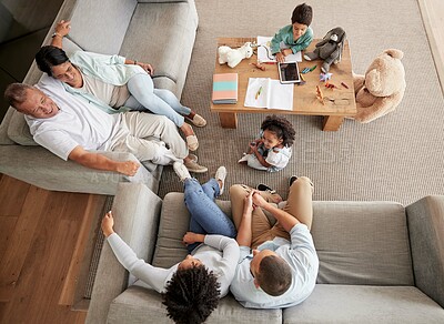 Buy stock photo Big family, talking and bonding during visit and sitting on sofa in lounge with children, parents and grandparents. Love, happiness and guest or multi generation people together to relax and have fun