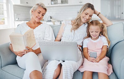 Buy stock photo Granny, mother and child bonding, happy and smile in the living room with book, laptop and smartphone on couch. Grandmother, mama and girl have fun, playing and being together in lounge on sofa