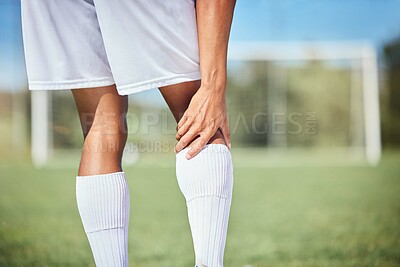 Buy stock photo Sports, soccer player and man with knee injury, torn muscle or strain after game, competition or fitness practice. Exercise, grass pitch workout or football training accident for athlete legs in pain