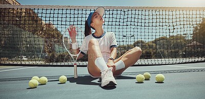 Buy stock photo Tennis, athlete and woman ready for a tennis match while sitting on the court with tennis balls. Fitness, active and young girl holding a tennis racket and ball ready for training or playing game 
